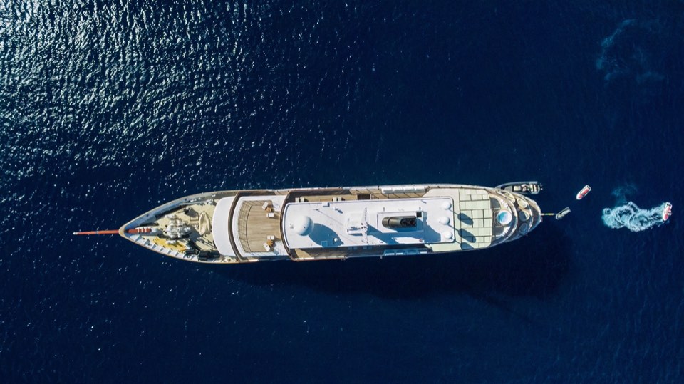 Drone view of M/Y Chakra (86 m) at anchor in deep blue water