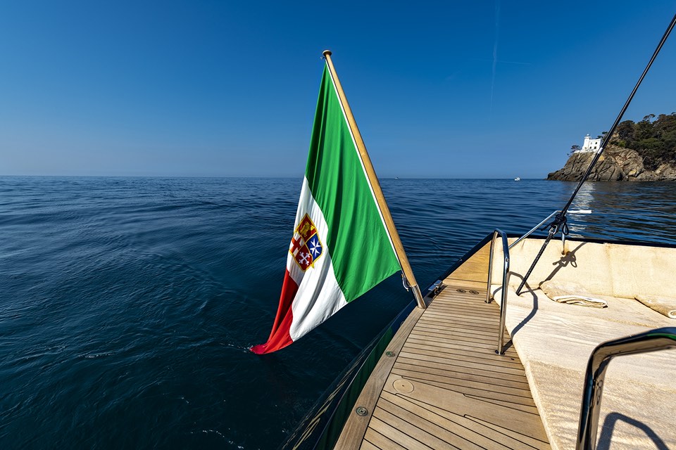 Italian ensign flying at the stern of a sailing yacht